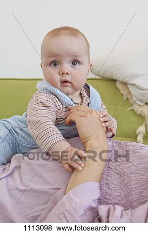 A toddler lying on her pregnant mother's abdomen View Large Photo Image Stock Photo - A toddler lying on her pregnant mother's abdomen. Fotosearch