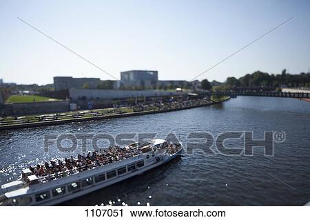 Stock Image - A tour boat on the Spree River, Germany, tilt-shift. Fotosearch