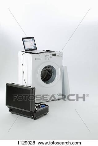 A washing machine being serviced View Large Photo Image Stock Photo - A washing machine being serviced. Fotosearch