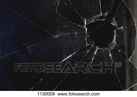 A window with a hole broken through the glass, night View Large Photo Image Stock Photo - A window with a hole broken through the glass, night. Fotosearch