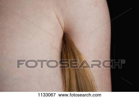 A woman with long hair coming from her armpit View Large Photo Image Stock Photo - A woman with long hair coming from her armpit. Fotosearch