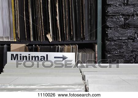 Stock Photograph - An arrow sign pointing towards the Minimal section of a record store. Fotosearch