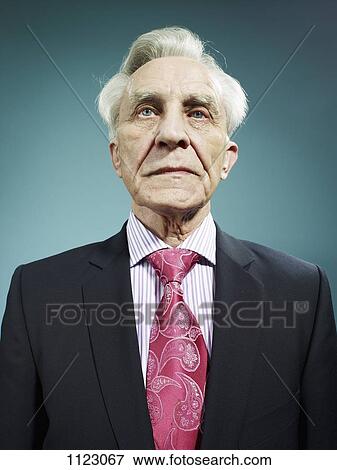 An elegant senior man wearing a suit and bright pink tie View Large Photo Image Stock Photo - An elegant senior man wearing a suit and bright pink tie. Fotosearch