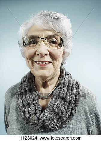 An elegant senior woman smiling at the camera View Large Photo Image Picture - An elegant senior woman smiling at the camera. Fotosearch