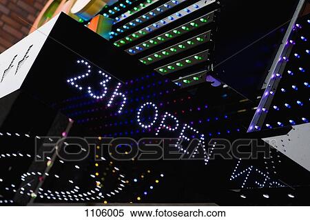 An illuminated 23h OPEN sign on the outside of a building View Large Photo Image Stock Photography - An illuminated 23h OPEN sign on the outside of a building. Fotosearch