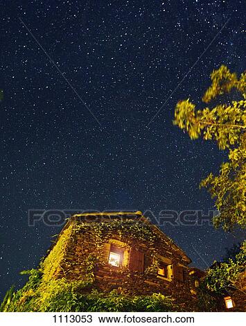 An ivy covered house under a star filled night sky View Large Photo Image Stock Image - An ivy covered house under a star filled night sky. Fotosearch