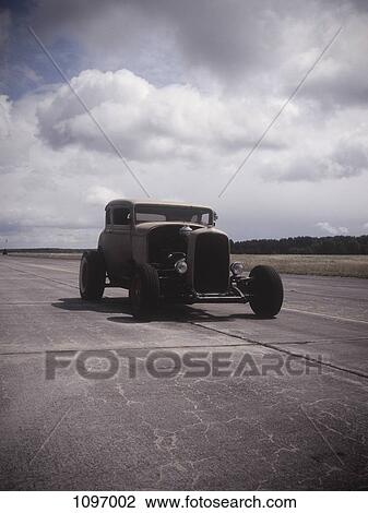 An old car on a race track View Large Photo Image Stock Image - An old car on a race track. Fotosearch