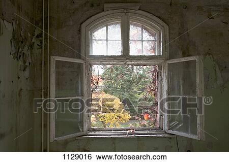 Stock Photograph - An open window in an abandoned building, Beelitz-Heilstaetten, Germany. Fotosearch