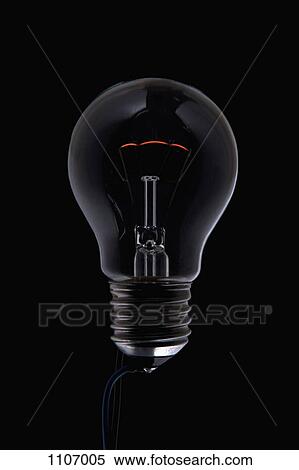 An unlit light bulb in the dark View Large Photo Image Stock Photography - An unlit light bulb in the dark. Fotosearch