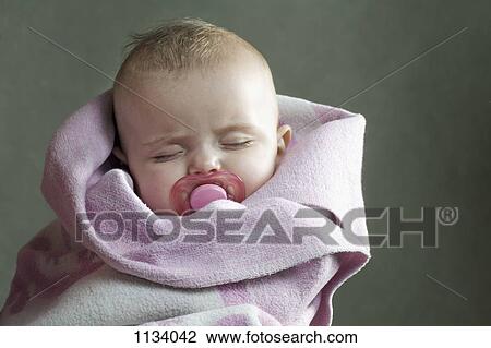 Baby girl wrapped in towel View Large Photo Image Stock Image - Baby girl wrapped in towel. Fotosearch