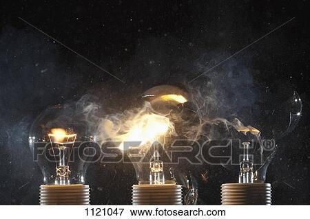 Stock Photo - Burning and exploding light bulbs. Fotosearch