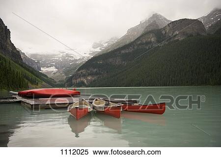 Canoes on Lake Louise, Banff National Park, Alberta, Canada View Large Photo Image Stock Photography - Canoes on Lake Louise, Banff National Park, Alberta, Canada. Fotosearch
