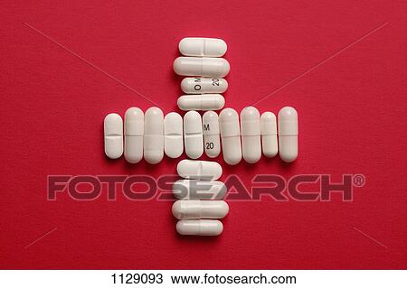 Capsules and tablets arranged in a cross shape View Large Photo Image Stock Image - Capsules and tablets arranged in a cross shape. Fotosearch