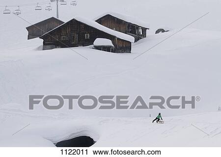 Child on sledge below log cabins on snowy hill View Large Photo Image Stock Image - Child on sledge below log cabins on snowy hill. Fotosearch