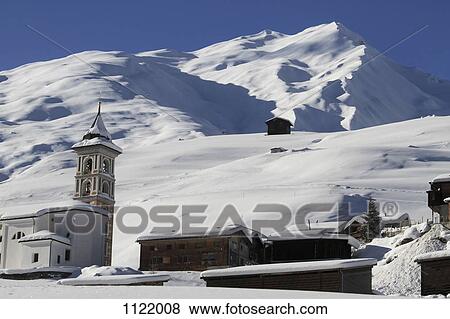 Stock Photo - Church and village in mountains. Fotosearch