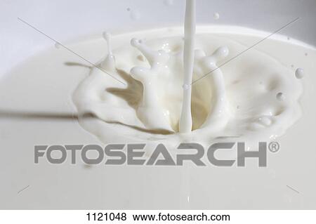 Close-up of milk being poured View Large Photo Image Stock Photo - Close-up of milk being poured. Fotosearch
