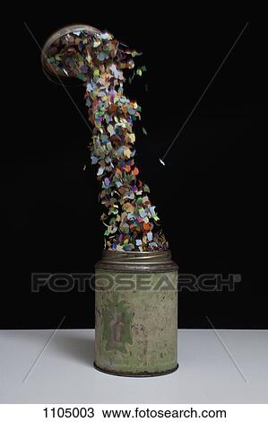 Confetti flying out of an old-fashioned metal tin View Large Photo Image Stock Image - Confetti flying out of an old-fashioned metal tin. Fotosearch