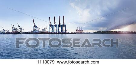 Cranes on a loading dock View Large Photo Image Stock Photo - Cranes on a loading dock. Fotosearch