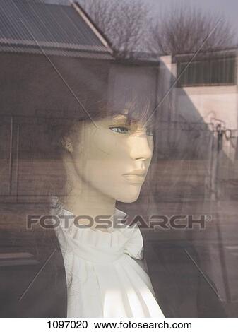 Stock Image - Detail of a female mannequin in a store window. Fotosearch