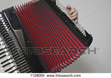 Detail of a man playing an accordion View Large Photo Image Stock Photography - Detail of a man playing an accordion. Fotosearch