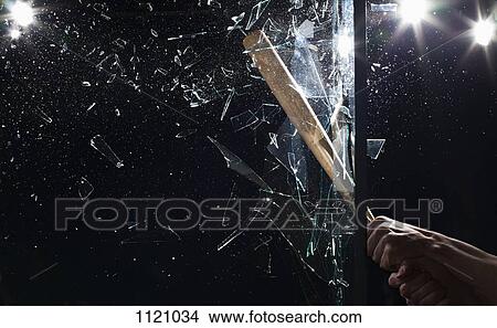Detail of a man smashing glass with a baseball bat View Large Photo Image Picture - Detail of a man smashing glass with a baseball bat. Fotosearch