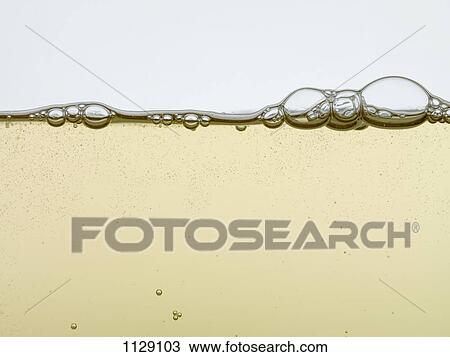 Stock Image - Detail of a sparkling drink in a glass. Fotosearch