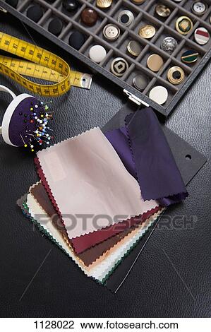 Detail of fabric samples, buttons, and other sewing equipment View Large Photo Image Stock Image - Detail of fabric samples, buttons, and other sewing equipment. Fotosearch