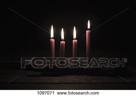 Four lit candles View Large Photo Image Stock Image - Four lit candles. Fotosearch