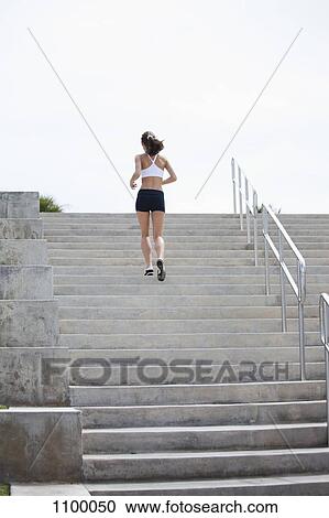 Girl jogging up steps View Large Photo Image Stock Image - Girl jogging up steps. Fotosearch