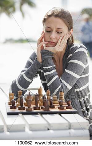 Girl plays chess outside View Large Photo Image Stock Image - Girl plays chess outside. Fotosearch