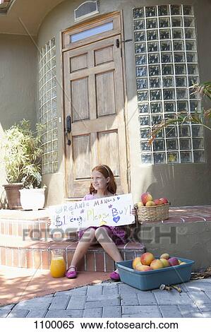 Girl selling apples on front porch and holding sign View Large Photo Image Stock Photography - Girl selling apples on front porch and holding sign. Fotosearch