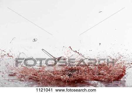 Glasses of red wine shattering View Large Photo Image Stock Image - Glasses of red wine shattering. Fotosearch