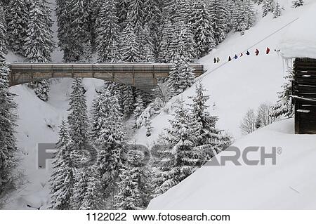 Group of people about to cross bridge View Large Photo Image Stock Image - Group of people about to cross bridge. Fotosearch