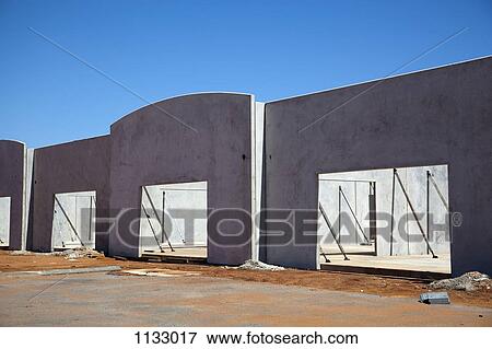 Half finished buildings at a construction site View Large Photo Image Stock Photo - Half finished buildings at a construction site. Fotosearch