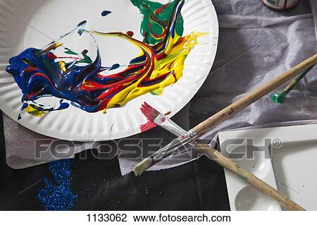 Heaps of acrylic paint on a paper plate and paintbrushes View Large Photo Image Stock Image - Heaps of acrylic paint on a paper plate and paintbrushes. Fotosearch