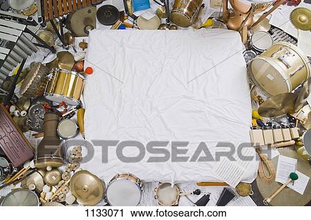 Heaps of various percussion instruments surrounding a white cloth View Large Photo Image Stock Image - Heaps of various percussion instruments surrounding a white cloth. Fotosearch