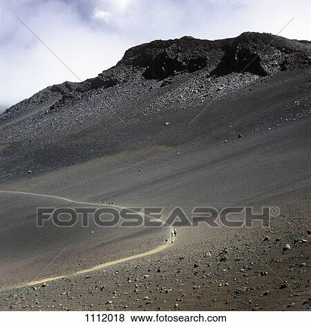 Hikers on a trail in the Haleakala National Park View Large Photo Image Stock Photo - Hikers on a trail in the Haleakala National Park. Fotosearch