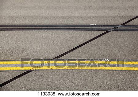 Stock Photo - Lines on an airplane runway. Fotosearch