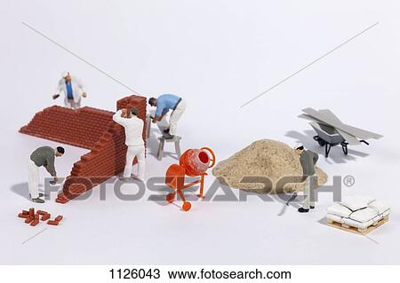 Miniature bricklayers building a brick wall View Large Photo Image Stock Image - Miniature bricklayers building a brick wall. Fotosearch