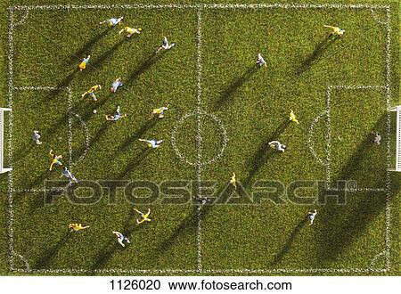 Miniature figurines of two soccer teams playing a soccer match, directly above View Large Photo Image Stock Image - Miniature figurines of two soccer teams playing a soccer match, directly above. Fotosearch