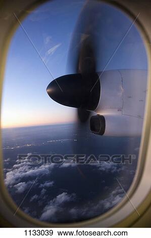 Moving airplane propeller seen through airplane window View Large Photo Image Stock Photo - Moving airplane propeller seen through airplane window. Fotosearch