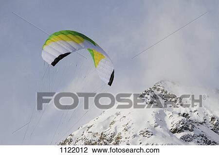 Paragliding over mountain View Large Photo Image Stock Image - Paragliding over mountain. Fotosearch
