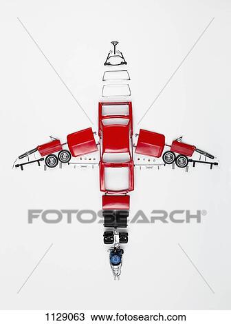 Stock Image - Parts of a model car arranged in the form of an airplane. Fotosearch