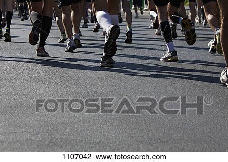 People running a marathon, low section, close-up View Large Photo Image Stock Image - People running a marathon, low section, close-up. Fotosearch