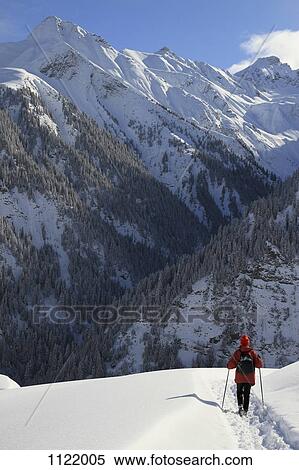 Person hiking on snowy mountain View Large Photo Image Stock Photography - Person hiking on snowy mountain. Fotosearch