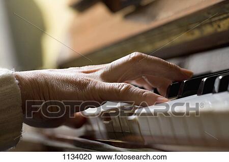 Piano chord pressed by woman's hand View Large Photo Image Stock Image - Piano chord pressed by woman's hand. Fotosearch