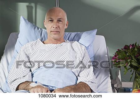 Portrait of a man in a hospital bed View Large Photo Image Picture - Portrait of a man in a hospital bed. Fotosearch