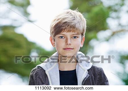 Portrait of a serious adolescent boy View Large Photo Image Stock Image - Portrait of a serious adolescent boy. Fotosearch