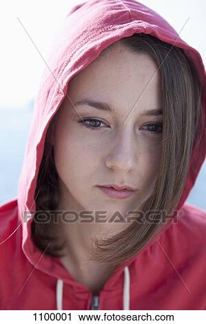 Stock Image - Portrait of girl daydreaming. Fotosearch