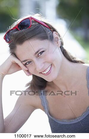 Portrait of girl with head on hand View Large Photo Image Stock Photo - Portrait of girl with head on hand. Fotosearch